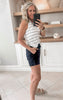 black shorts paired with stripe tank top