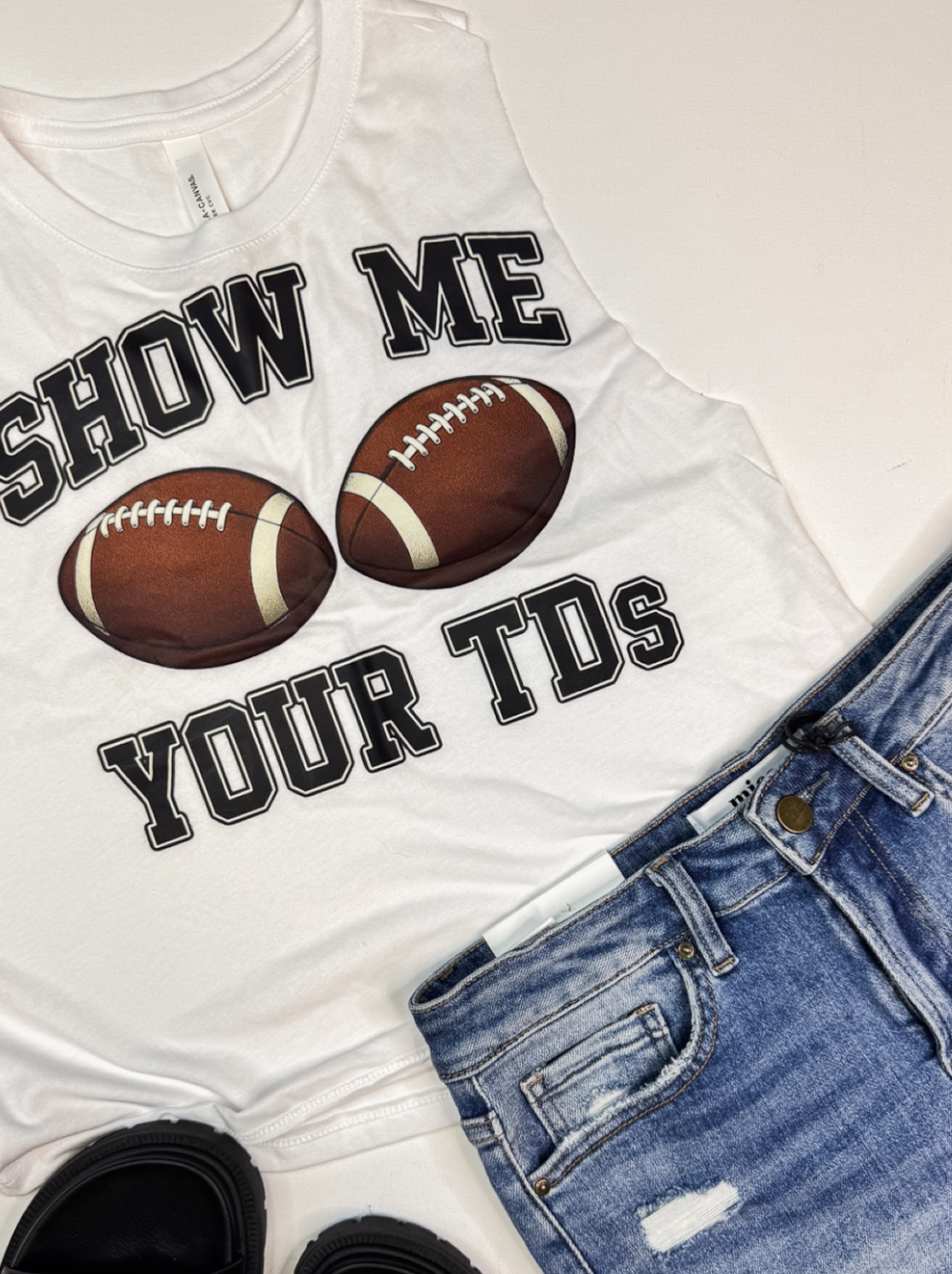 Close up of Show Me your TDs muscle tank top by Bella Canvas