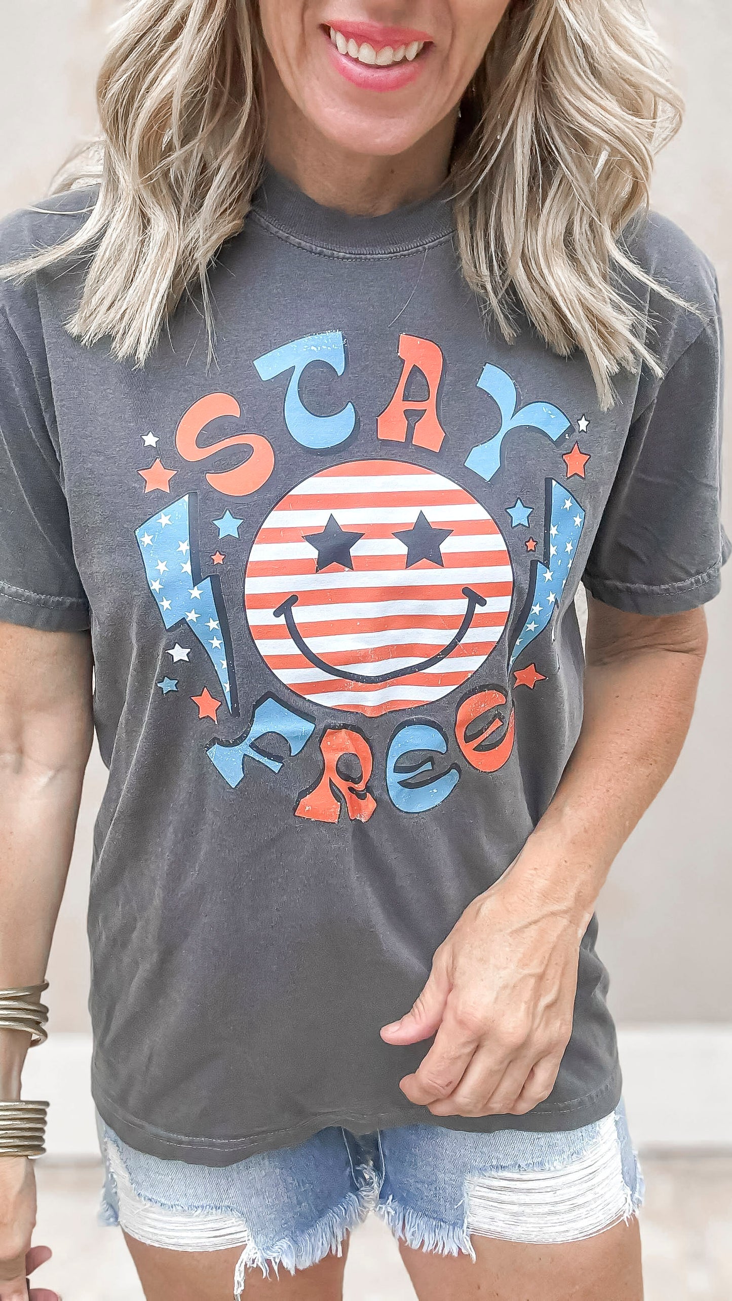 Vintage wash USA graphic t-shirt styled with distressed denim shorts.