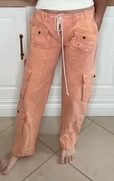 Relaxed fit wide leg cargo pants in apricot with washed finish and flap pockets.