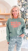 Heather Green Put it On Santa's Tab Crewneck Graphic Sweatshirt