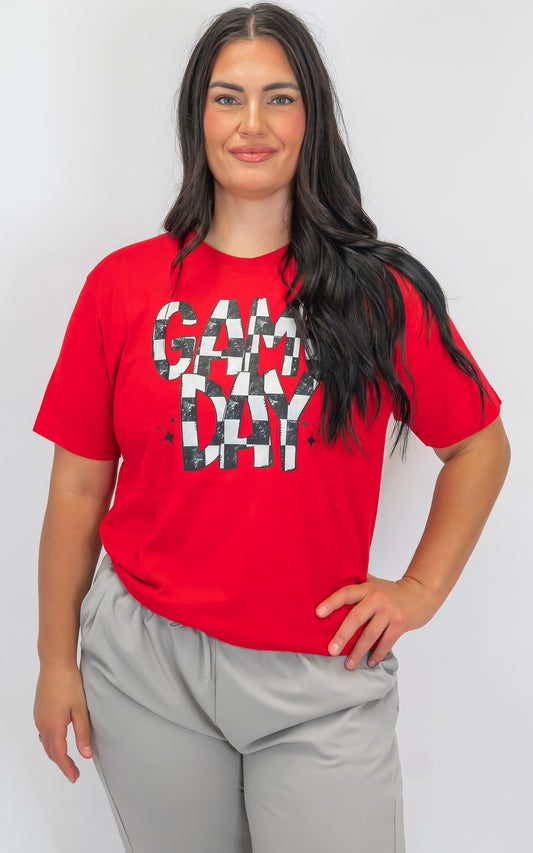 Woman wearing a red t-shirt with a graphic design on a white background