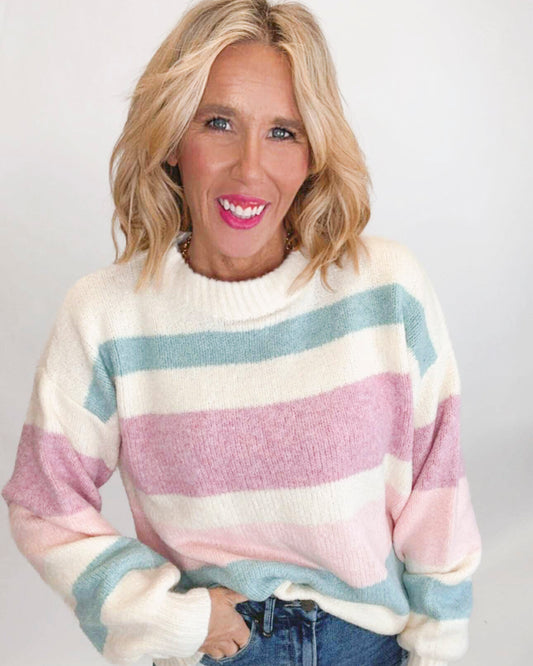 Color block knit stripe sweater on a white background