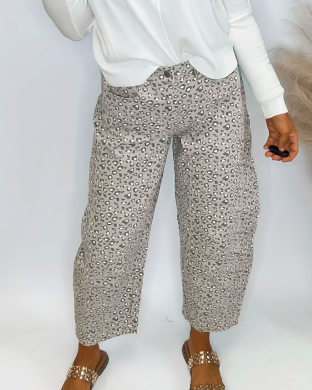 Close up image of the taupe leopard denim pants.