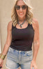 Solid black sleeveless top paired with distressed jean shorts for a casual look.