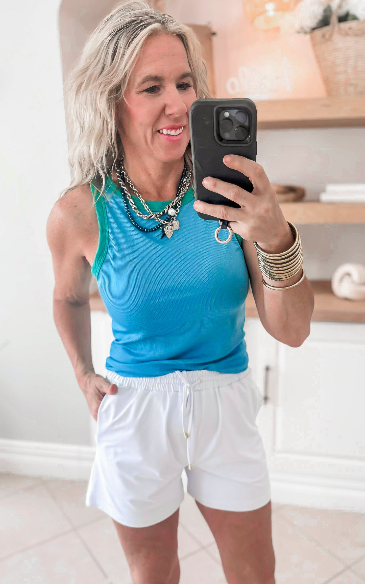 Bold contrast edge tank top styled with casual drawstring active shorts.