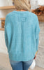 teal sweater