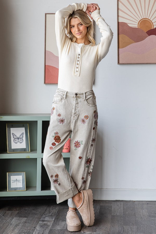 Relaxed fit grey denim with floral touches and stripe design.