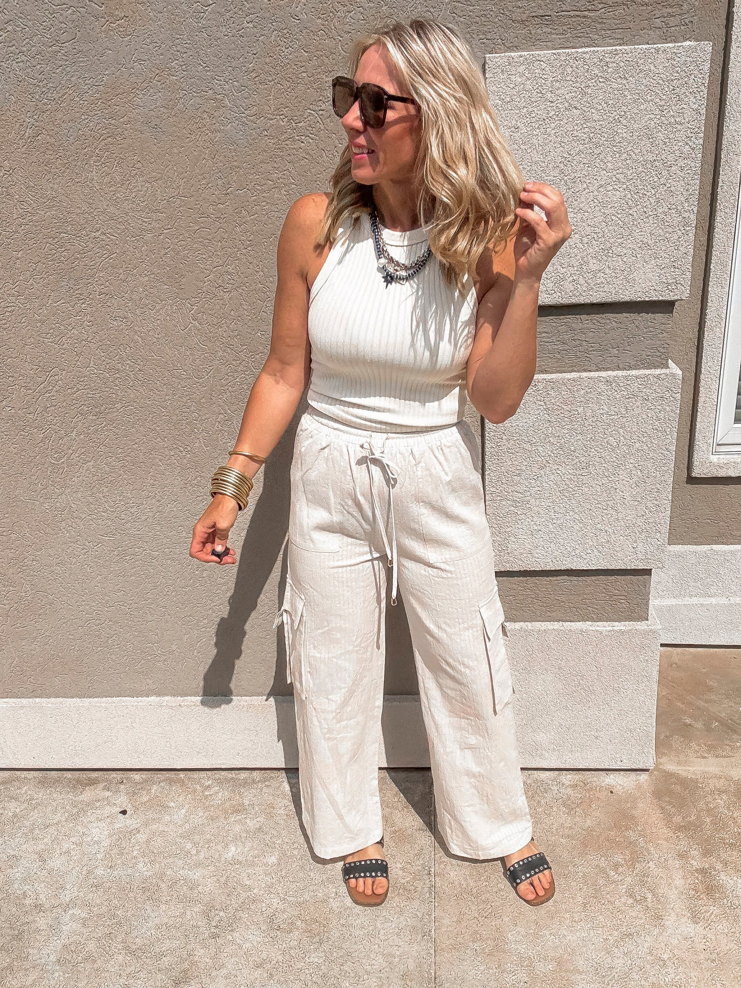 Neutral striped wide leg cargo trousers styled for casual everyday wear.