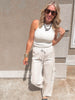 Khaki striped wide leg cargo pants with drawstring waist and side pockets.