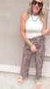 Relaxed fit animal print pants paired with neutral summer sandals.