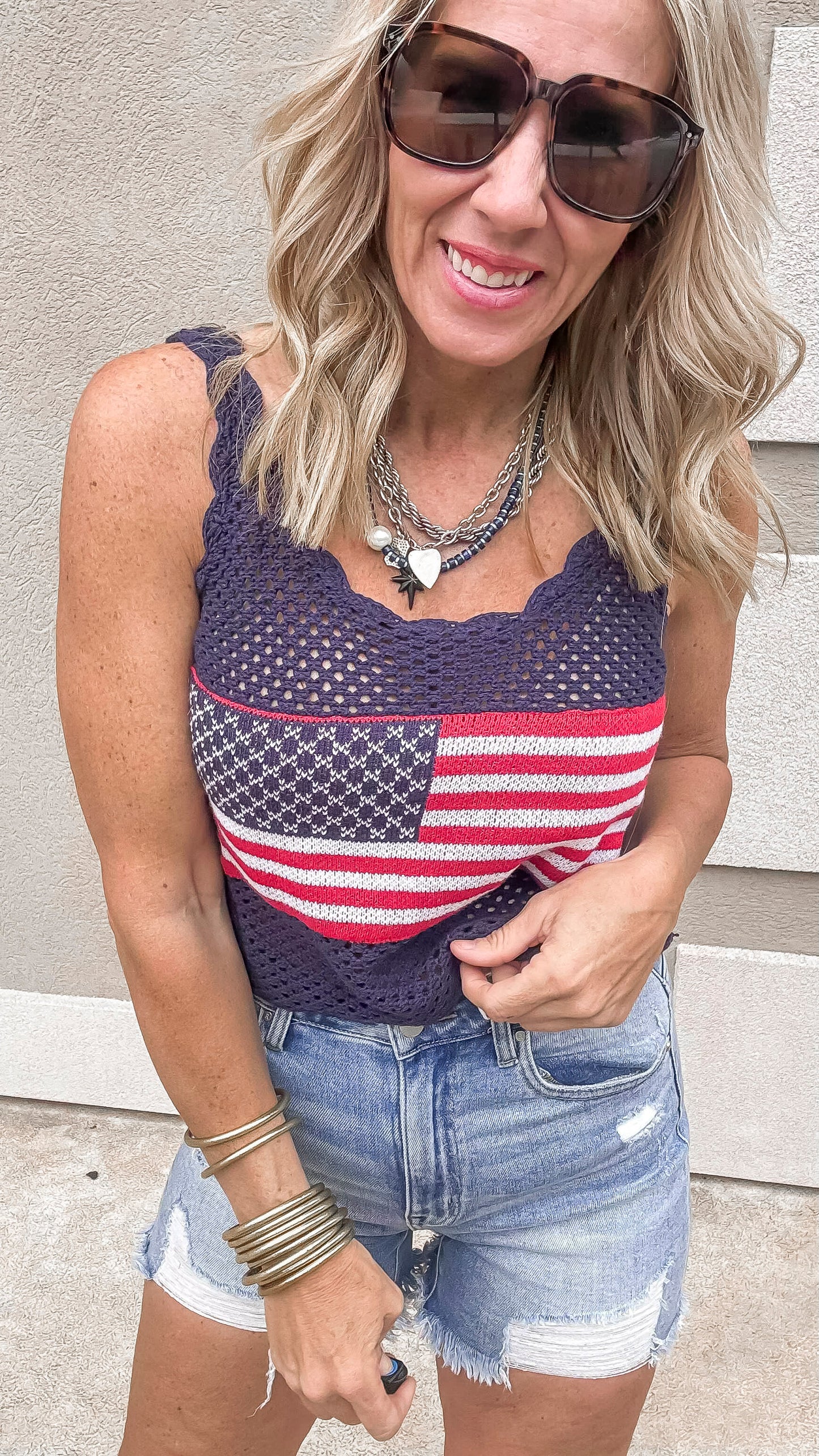 Boho USA tank top in navy paired with frayed jean shorts.