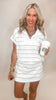 Sporty white skort with black vertical accents and performance stretch fabric.