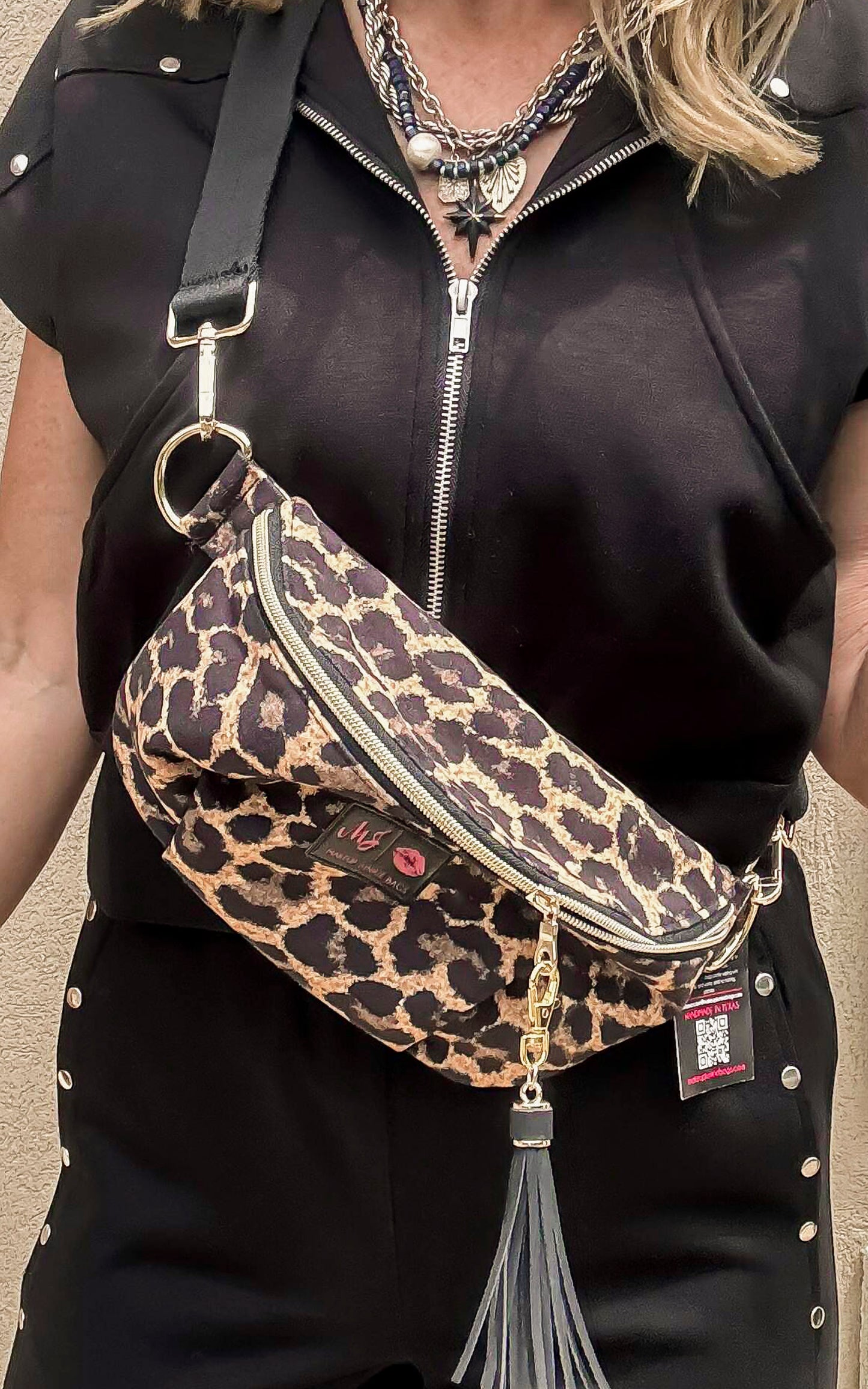 Cheetah print sidekick crossbody bag with tassel zipper and gold hardware.