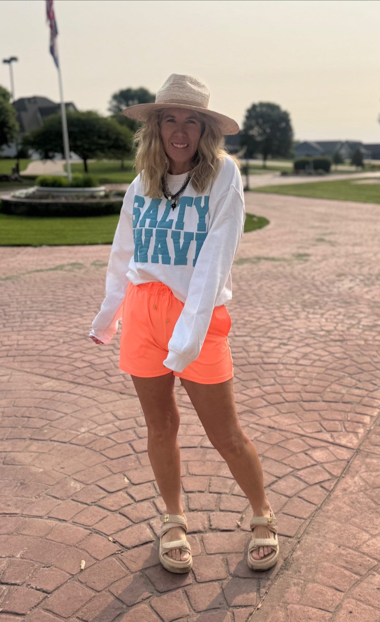 Cozy graphic crewneck featuring raised “SALTY WAVE” text in blue on white.