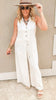Summer-ready jumpsuit with button front closure and flowy wide-leg silhouette.