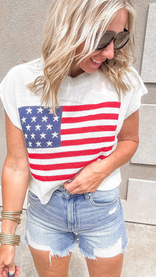Patriotic sleeveless sweater top featuring U.S. flag design