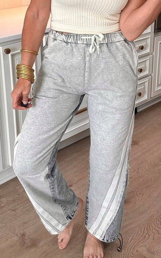 Two tone washed denim pants with elastic waistband and wide leg fit.