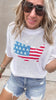 Lightweight American flag sweater and ripped jean shorts outfit.