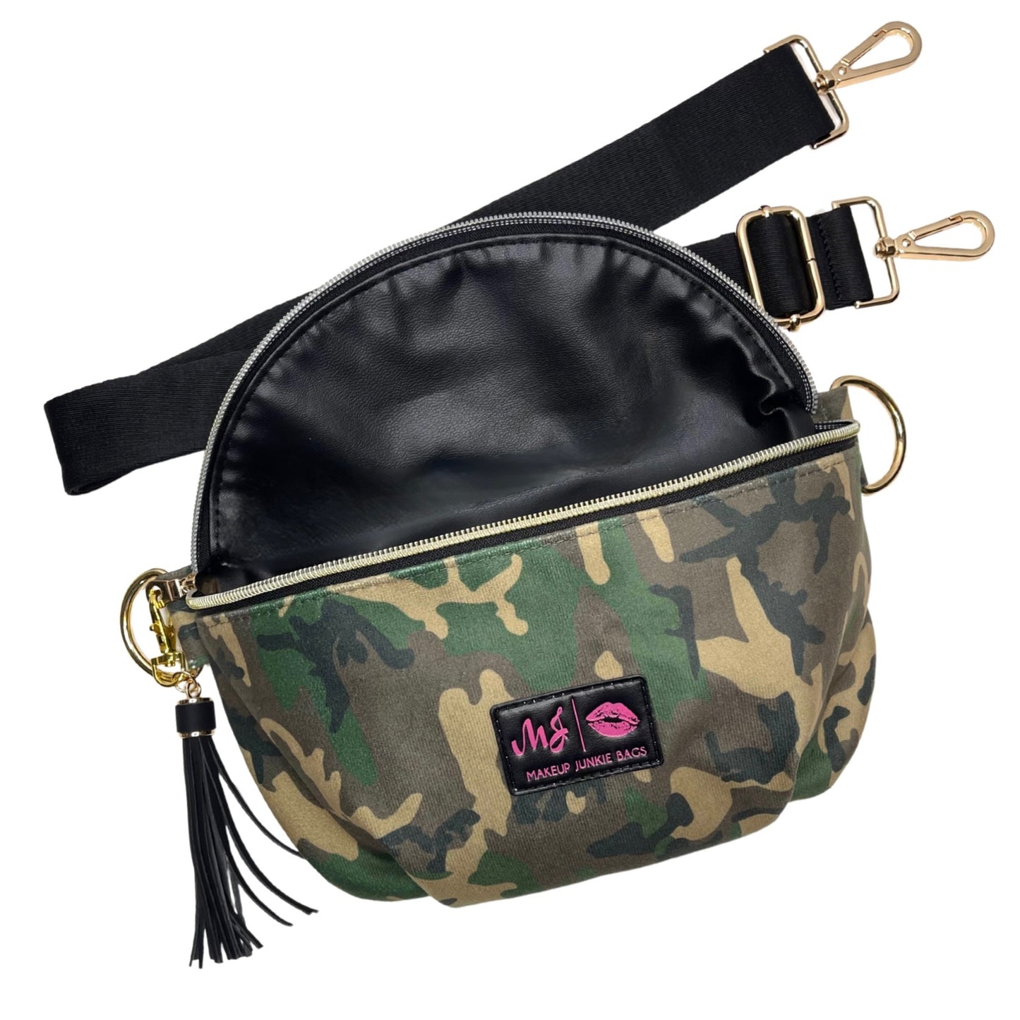 Close-up of camouflage Makeup Junkie sidekick bag with gold zipper and tassel on a flat white background