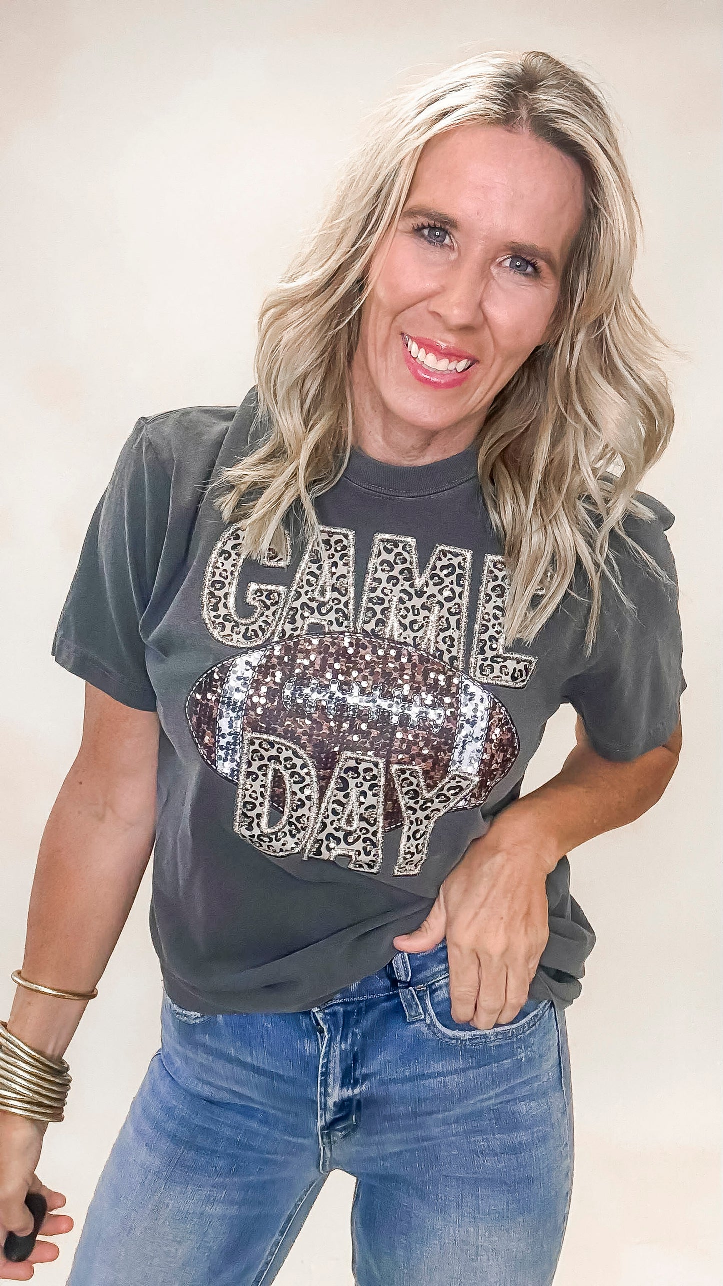 Casual sparkle Game Day graphic tee with a washed black pepper finish and oversized fit.