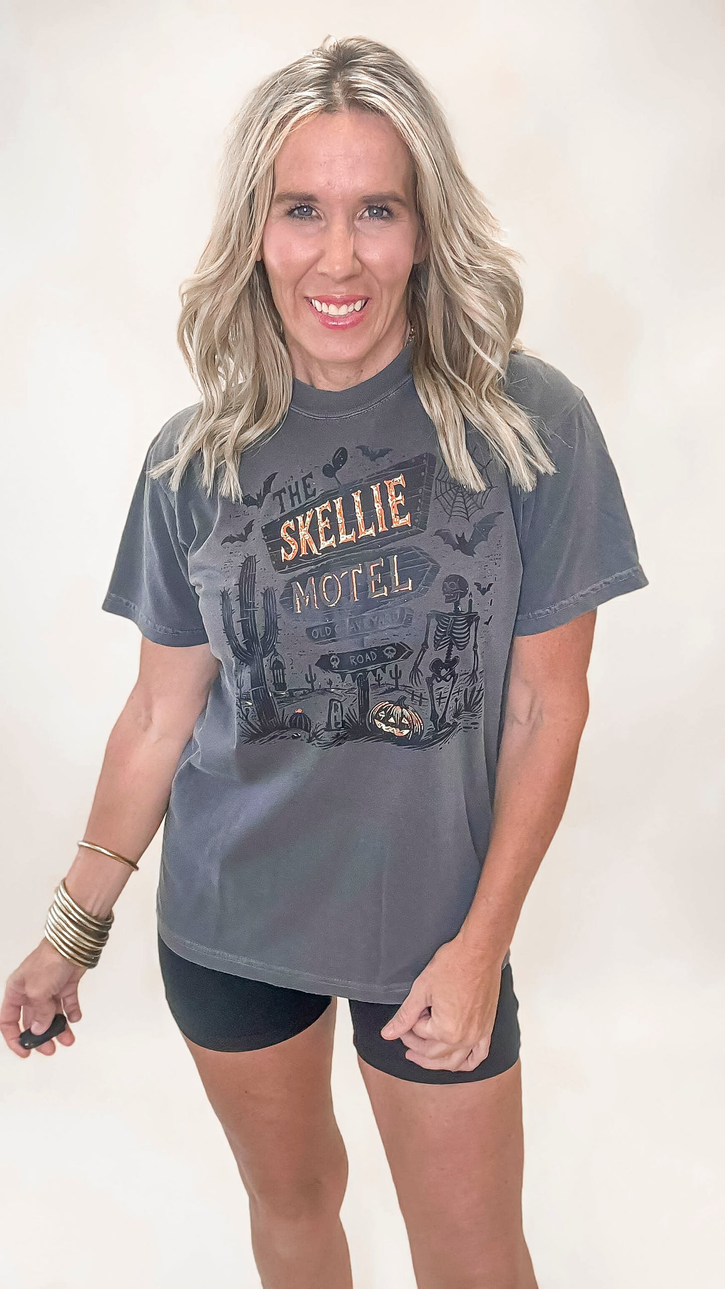 Creepy cute Skellie Motel tee in faded black, perfect for spooky season style