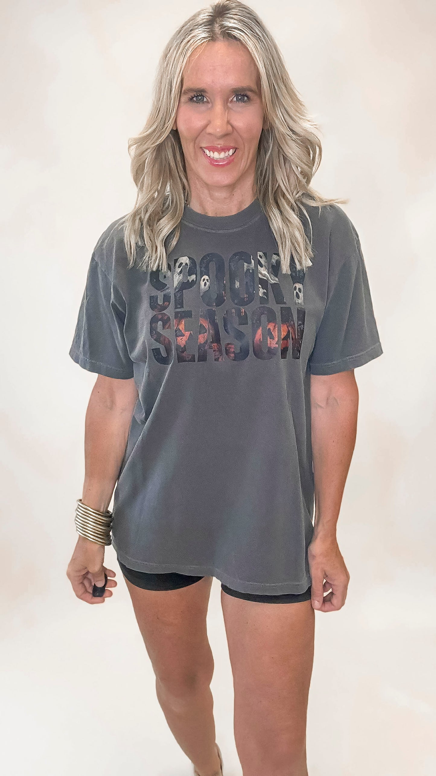 Unisex charcoal graphic t-shirt with festive Halloween print and spooky character collage inside the wording