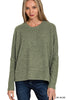 Woman wearing a green sweater on a white background