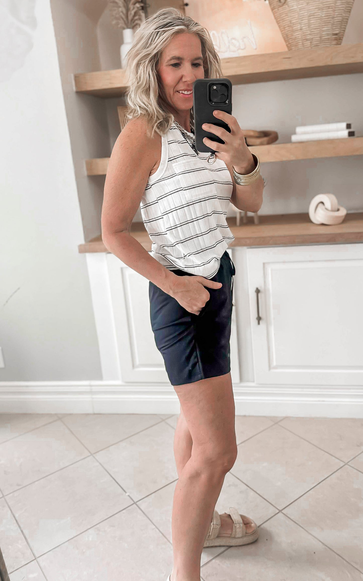 black shorts paired with stripe tank top 
