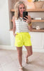 neon shorts and white/black tank top 