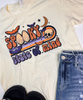 Cream-colored tee with playful spooky print including ghosts, bats, and a crescent moon.