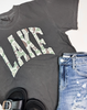 close up of graphic tee with the word Lake on it in Camo Print. 