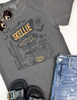 Dark graphic tee with haunted motel scene and desert skeleton artwork for Halloween vibes.