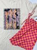 Halloween-themed t-shirt with checkered pants on a white background