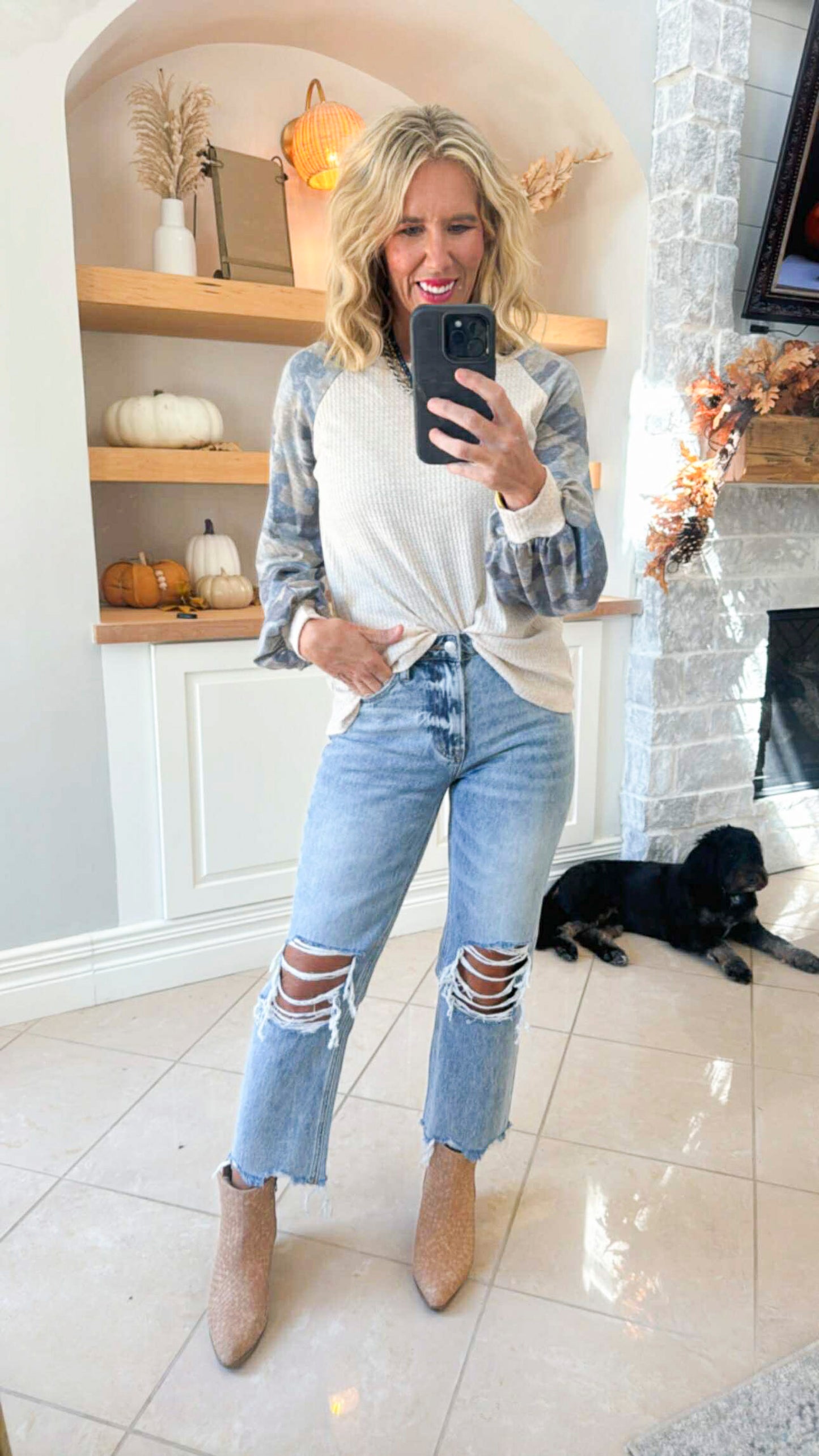 A Long Sleeve Top Featuring Camo Sleeves