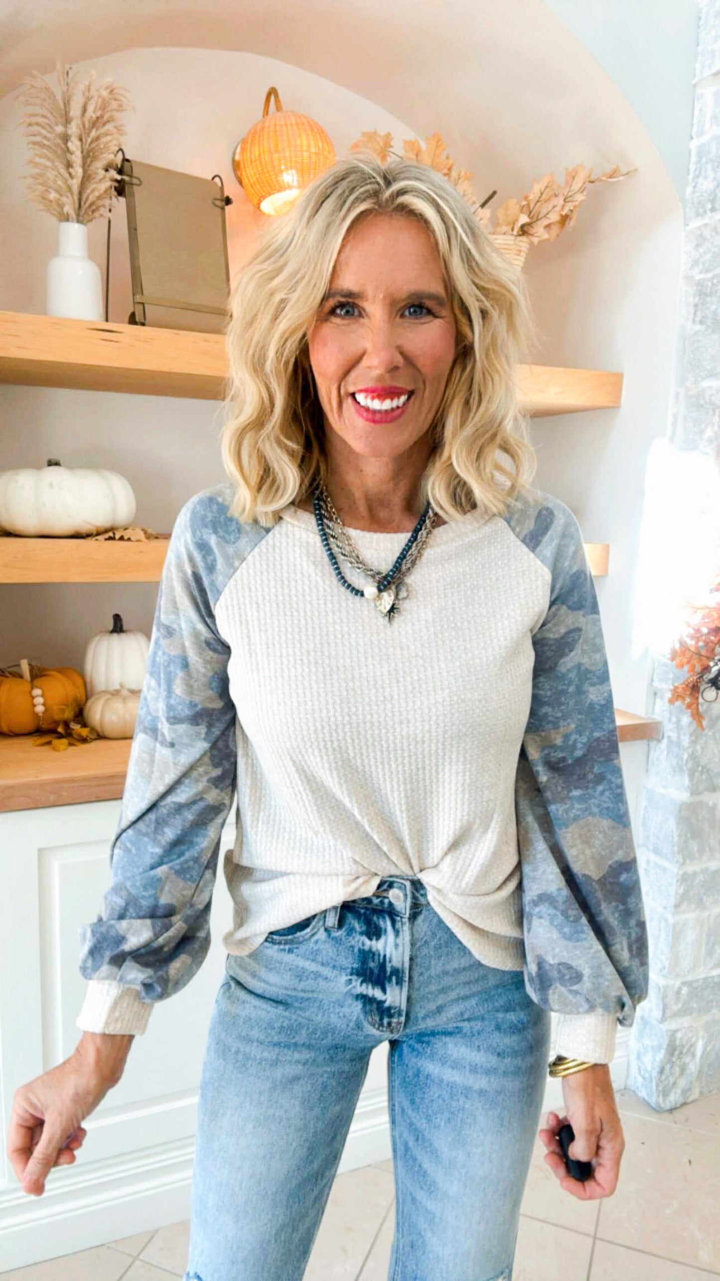 A Long Sleeve Top Featuring Camo Sleeves