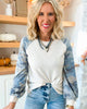 A Long Sleeve Top Featuring Camo Sleeves