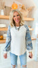A Long Sleeve Top Featuring Camo Sleeves
