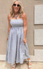 Sleeveless maxi dress in blue tones with a fitted bodice and full skirt."