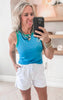Bold contrast edge tank top styled with casual drawstring active shorts.
