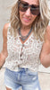 Geometric crochet button-up tank styled with ripped shorts.