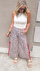 Leopard print jogger pants with red side ties and relaxed fit.