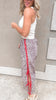 Casual wide-leg leopard joggers styled with a white ribbed tank.