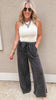 Comfy wide leg black pants in a vintage wash, styled with an elastic drawstring waist.