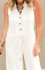 White sleeveless jumpsuit featuring a relaxed fit, collared neckline, and tie waist.