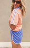 Casual athletic-style shorts in blue with vibrant orange trim for a fun pop of color.