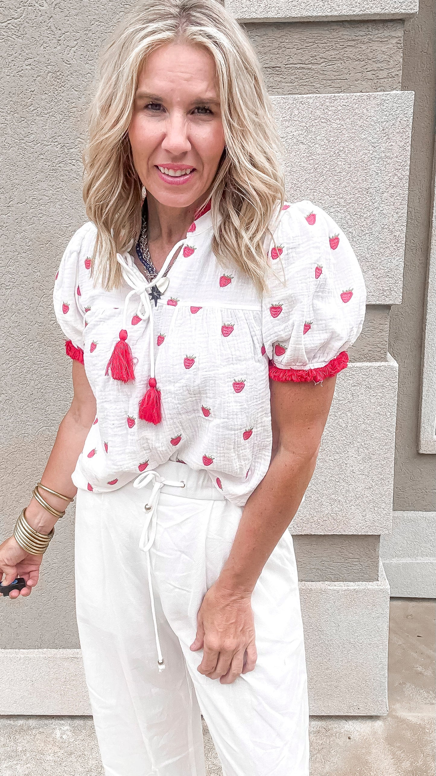 Breezy and feminine outfit featuring the Sweet as a Strawberry Embroidery Top styled with wide-leg white linen bottoms.