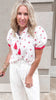Breezy and feminine outfit featuring the Sweet as a Strawberry Embroidery Top styled with wide-leg white linen bottoms.