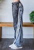 Washed wide leg jeans featuring color block panels and sporty side stripe.