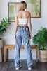 High rise oversized denim pants with elastic waist and bold contrast design.